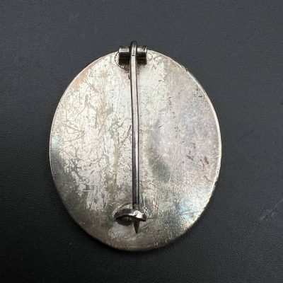 Silver wound badge.