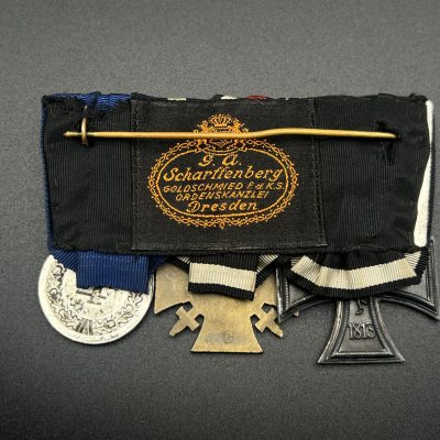 Three-Piece Medal Bar: Iron Cross 2nd Class 1914, WWI Honor Cross with Swords, Luftwaffe Long Service Medal.