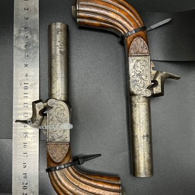 Pair of Continental Large Bore Drop Trigger Pocket Pistols