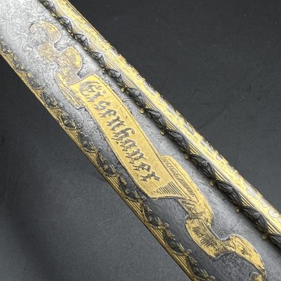 German Sword, pre-1918 Cavalry. Lion head [M. Neumann Berlin] Family Coat of Arms. Damascus steel, etching, gilding.